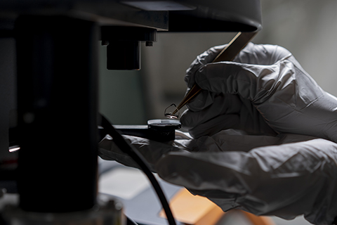 gloved-hands-interacting-with-lab-equipment