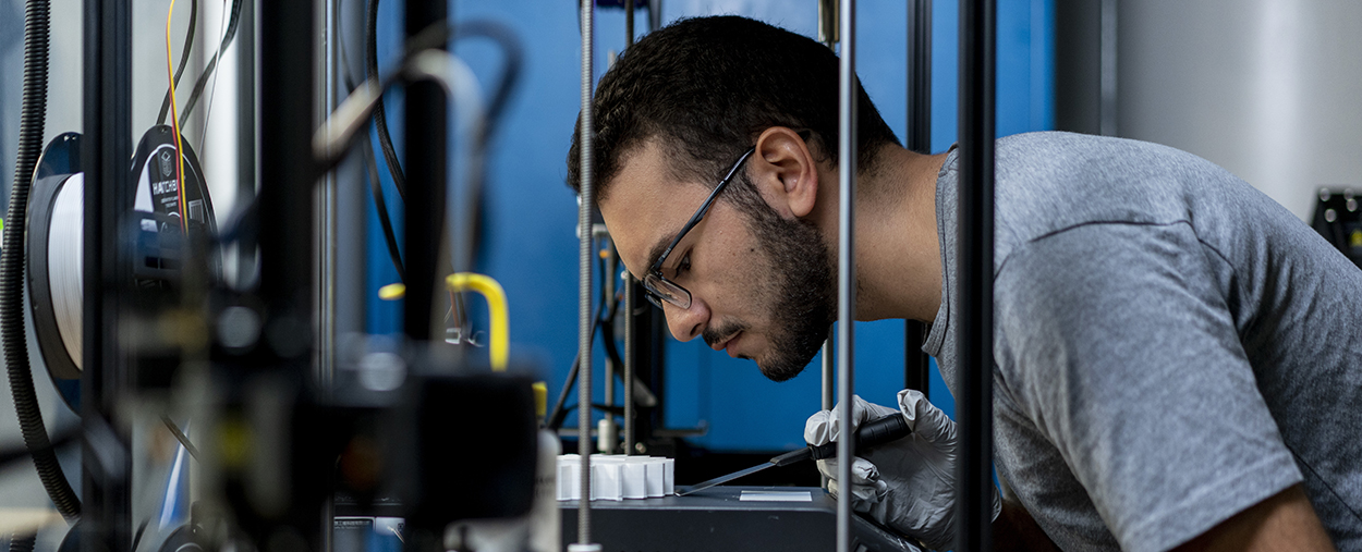 Student working with lab equipment