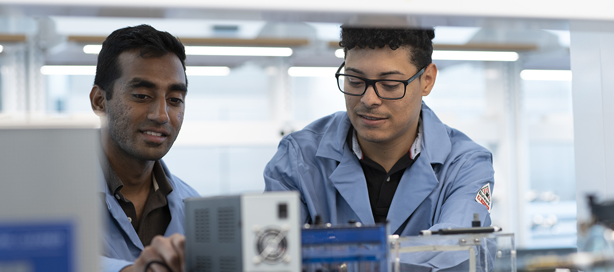 Engineering students working in a lab