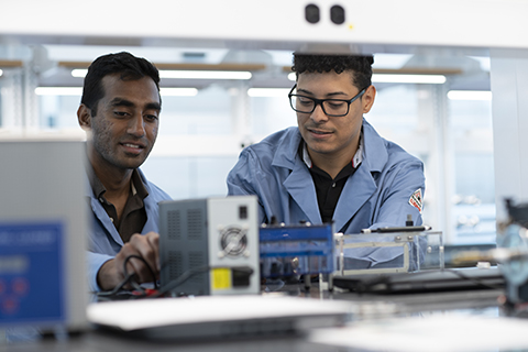 Engineering students working in a lab