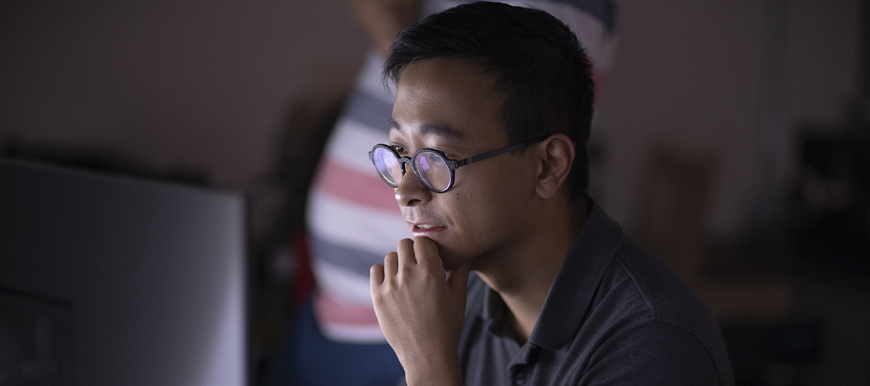 student working at a computer workstation